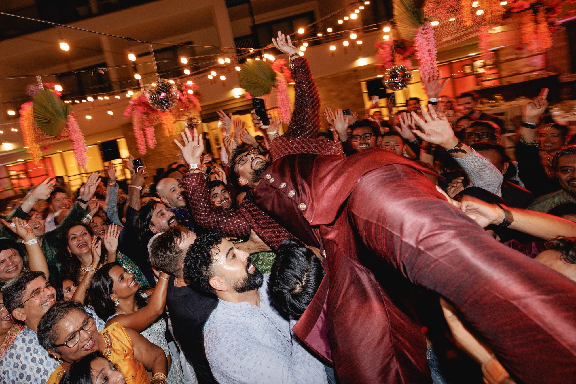 Crowd dancing with DJ Rahul on stage